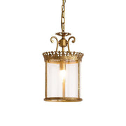 Gentry Pendant Lamp with a brass body and clear glass shade.