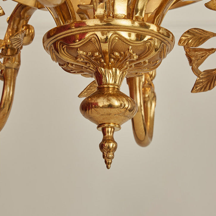 Another angle of the chandelier hanging in a decorated room.