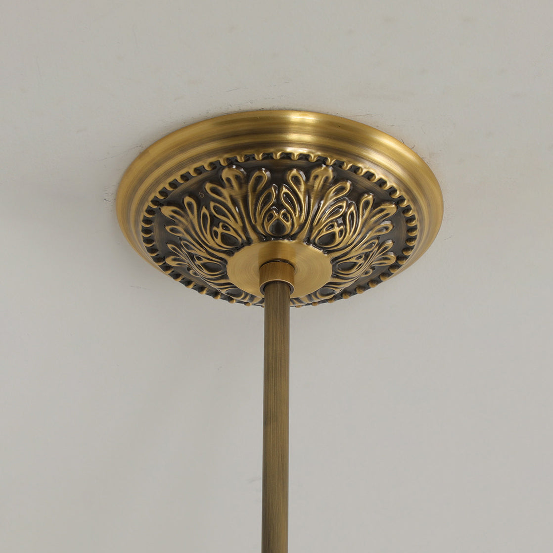 Lifestyle image of the chandelier in a grand entryway.