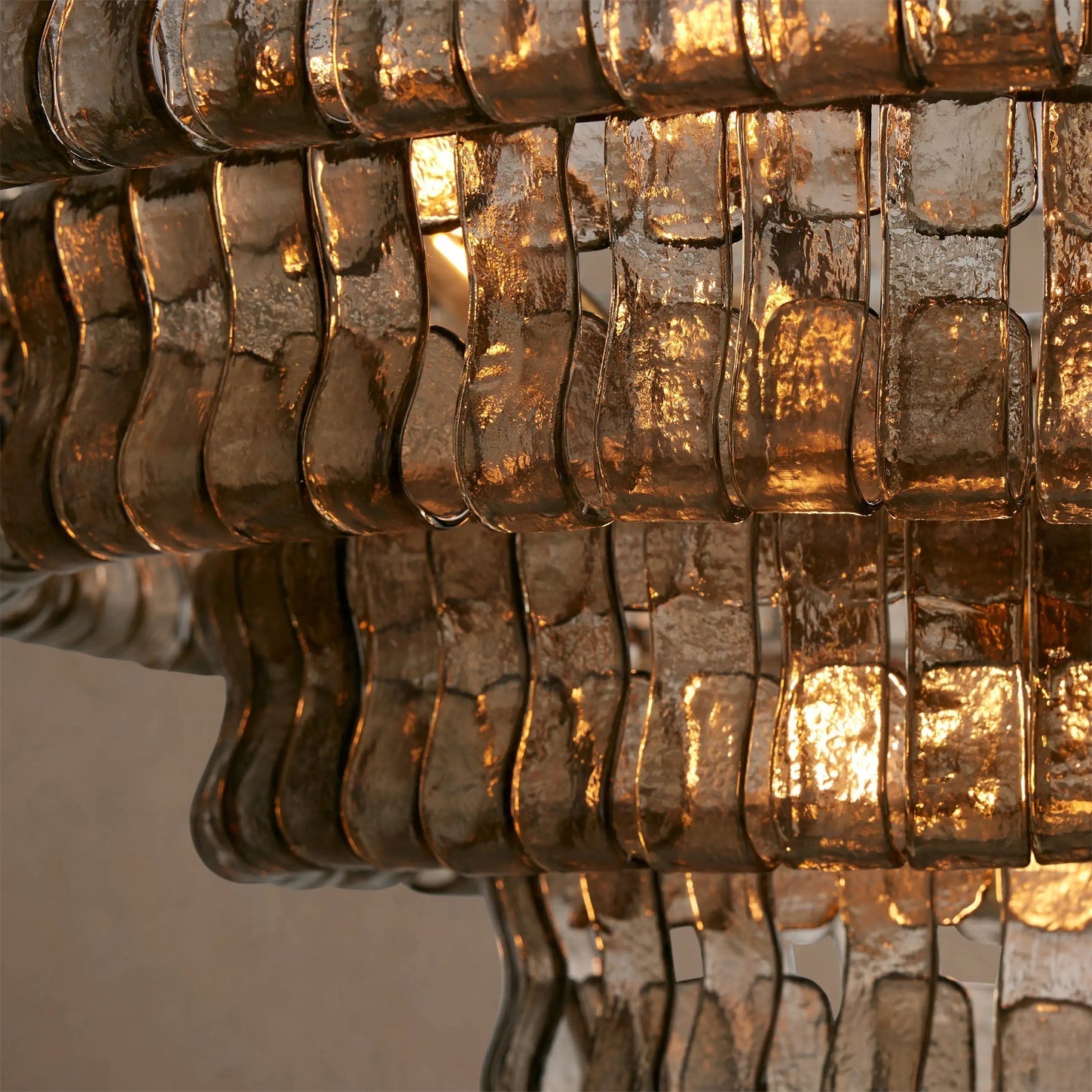 The large Ghiaccio Chandelier as a centerpiece in a great room.