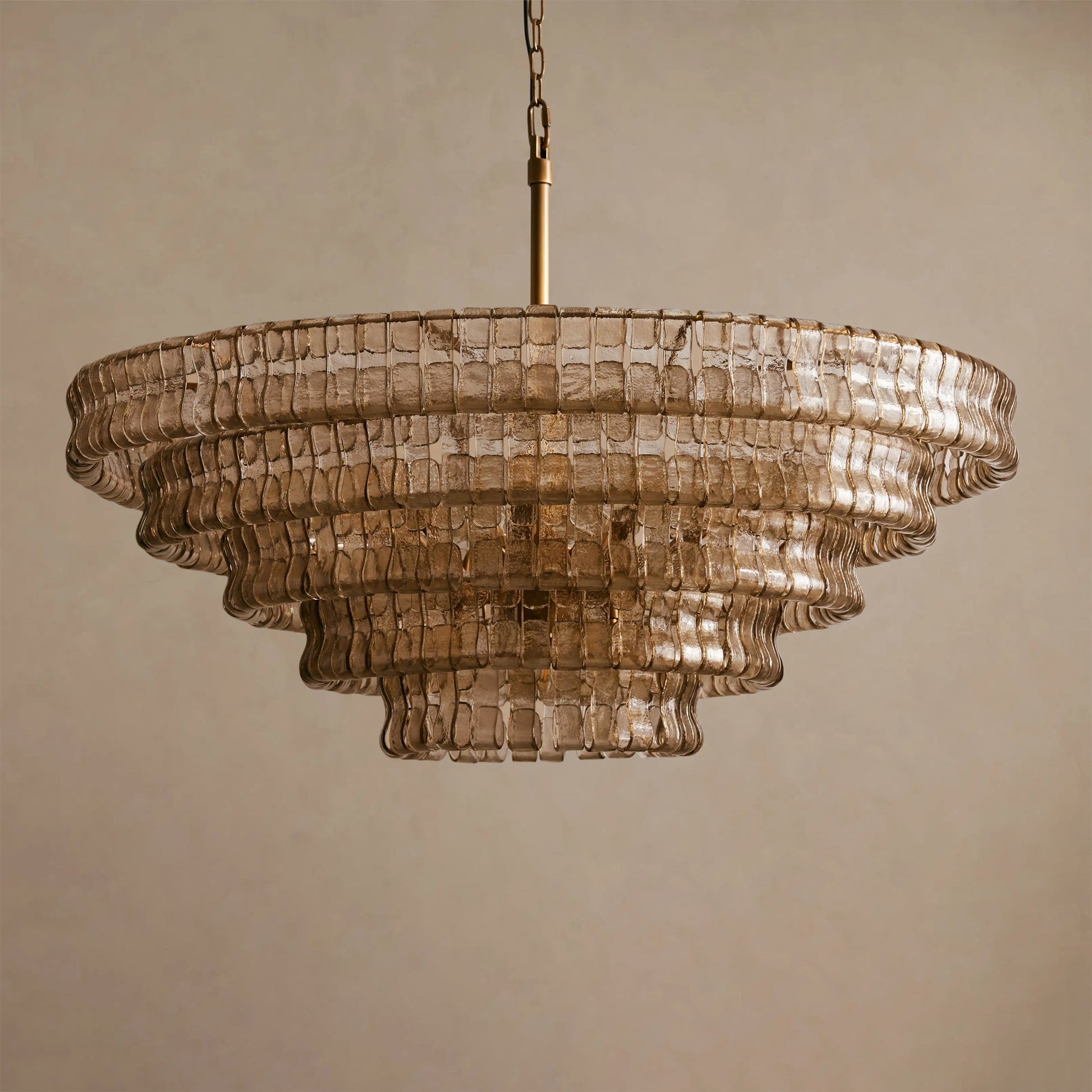 The ambient light cast by the Ghiaccio Chandelier in a dimly lit room.