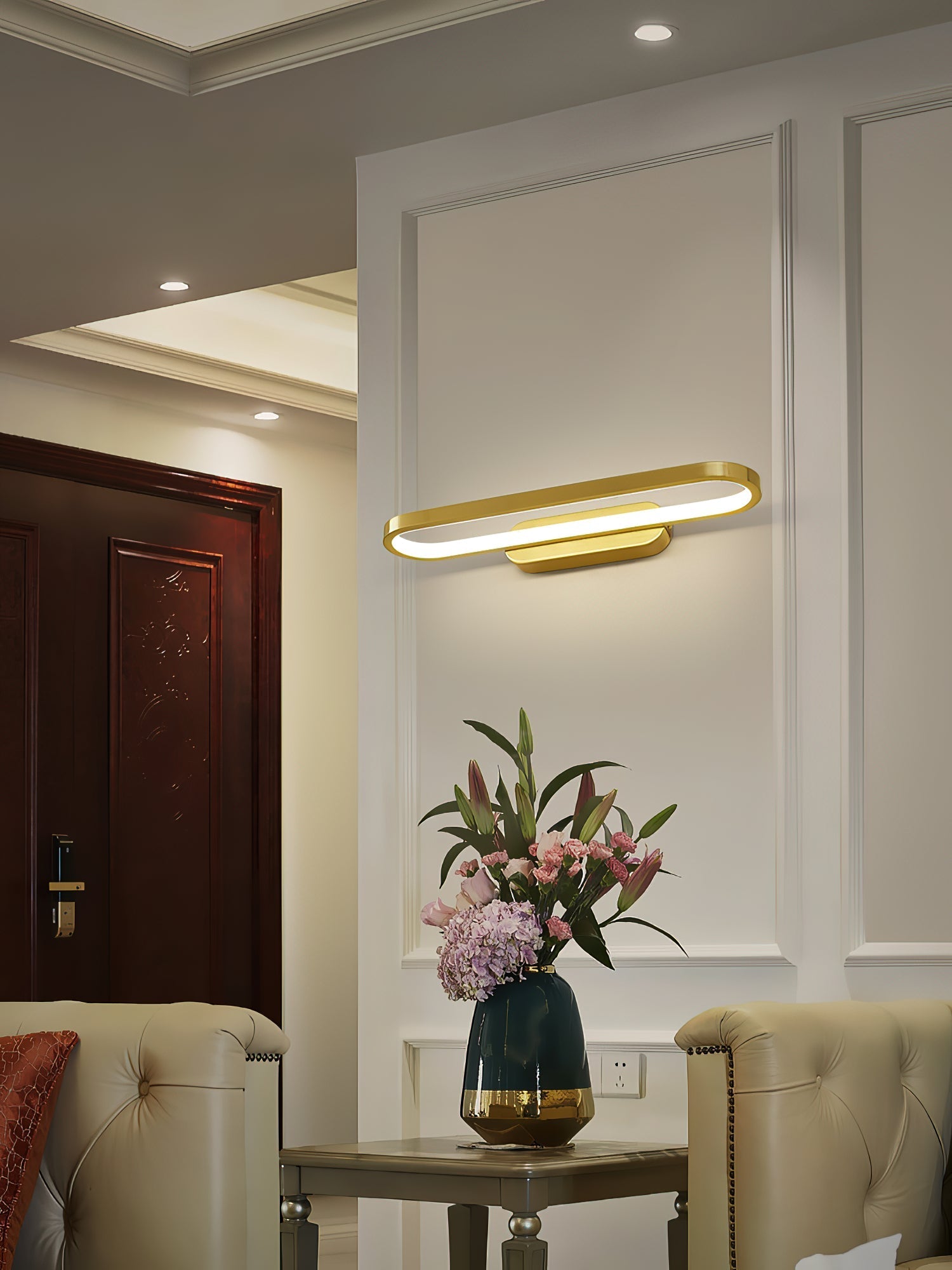 Gianni LED Wall Lamp illuminated with warm light.