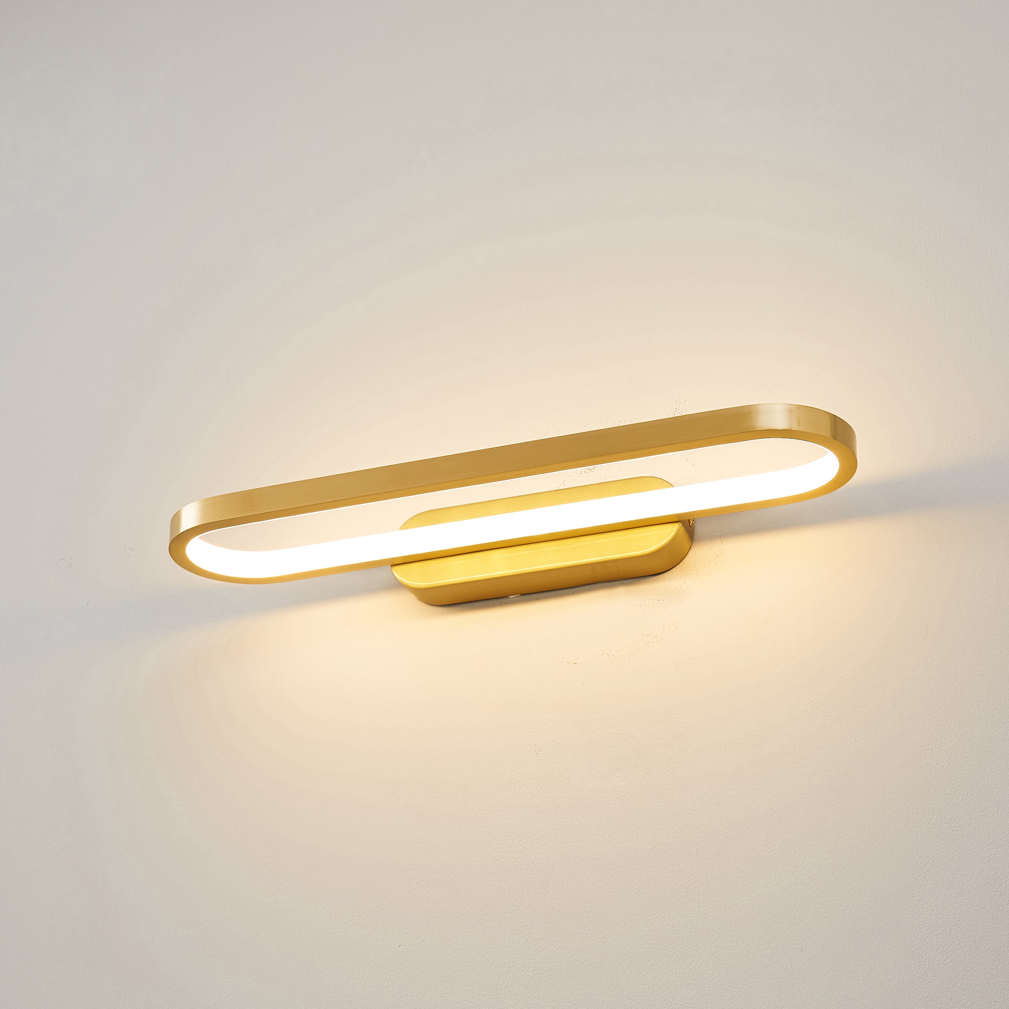 Lifestyle image of two Gianni LED Wall Lamps flanking a bathroom mirror.