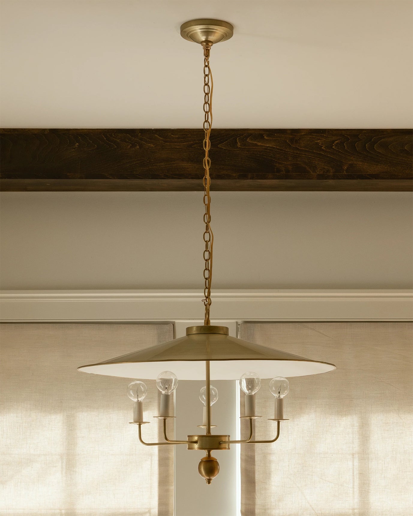 Gideon Pendant Lamp illuminated, casting a warm glow.