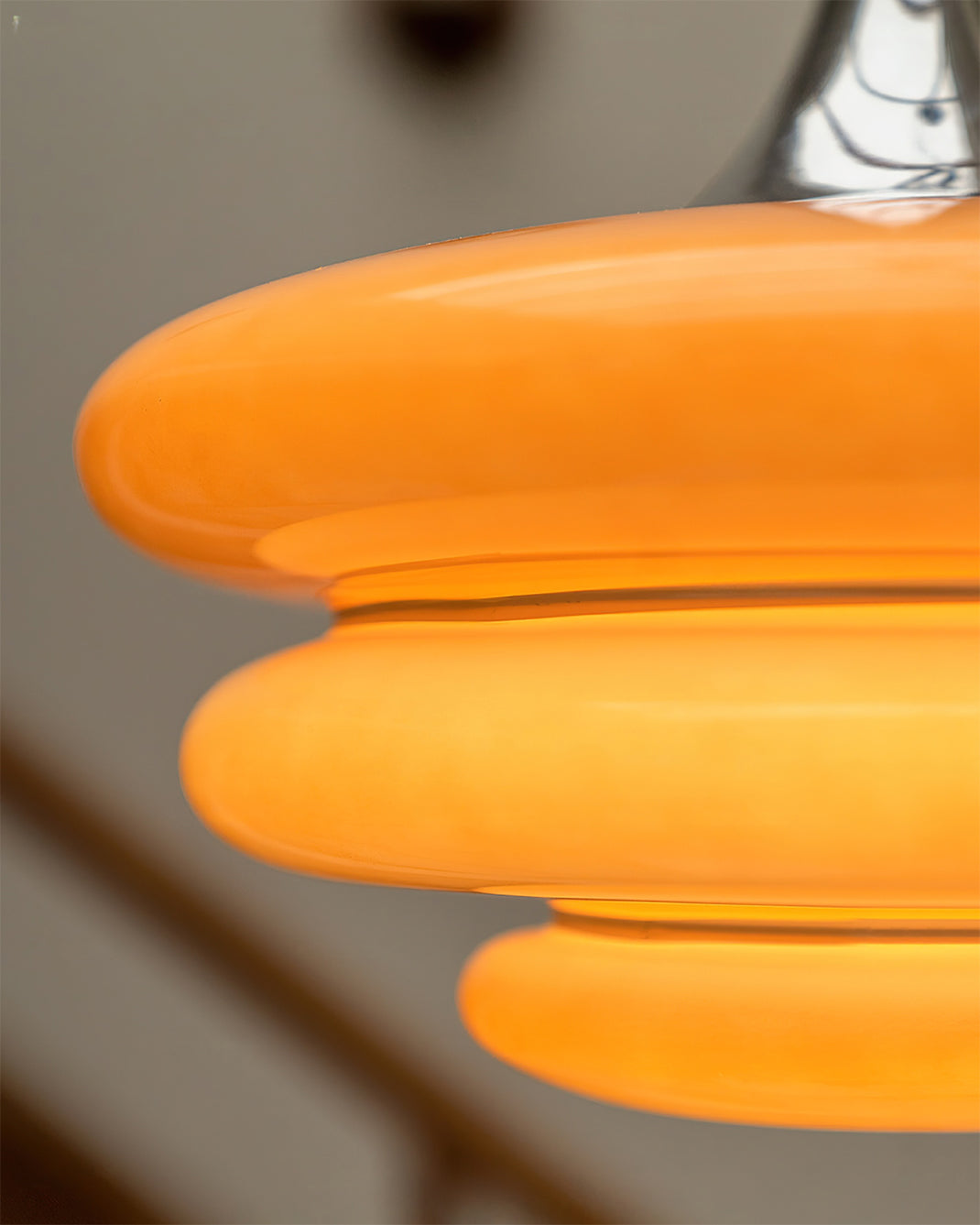 Lifestyle image of the Gispen Orange Pendant Light in a retro-styled interior.