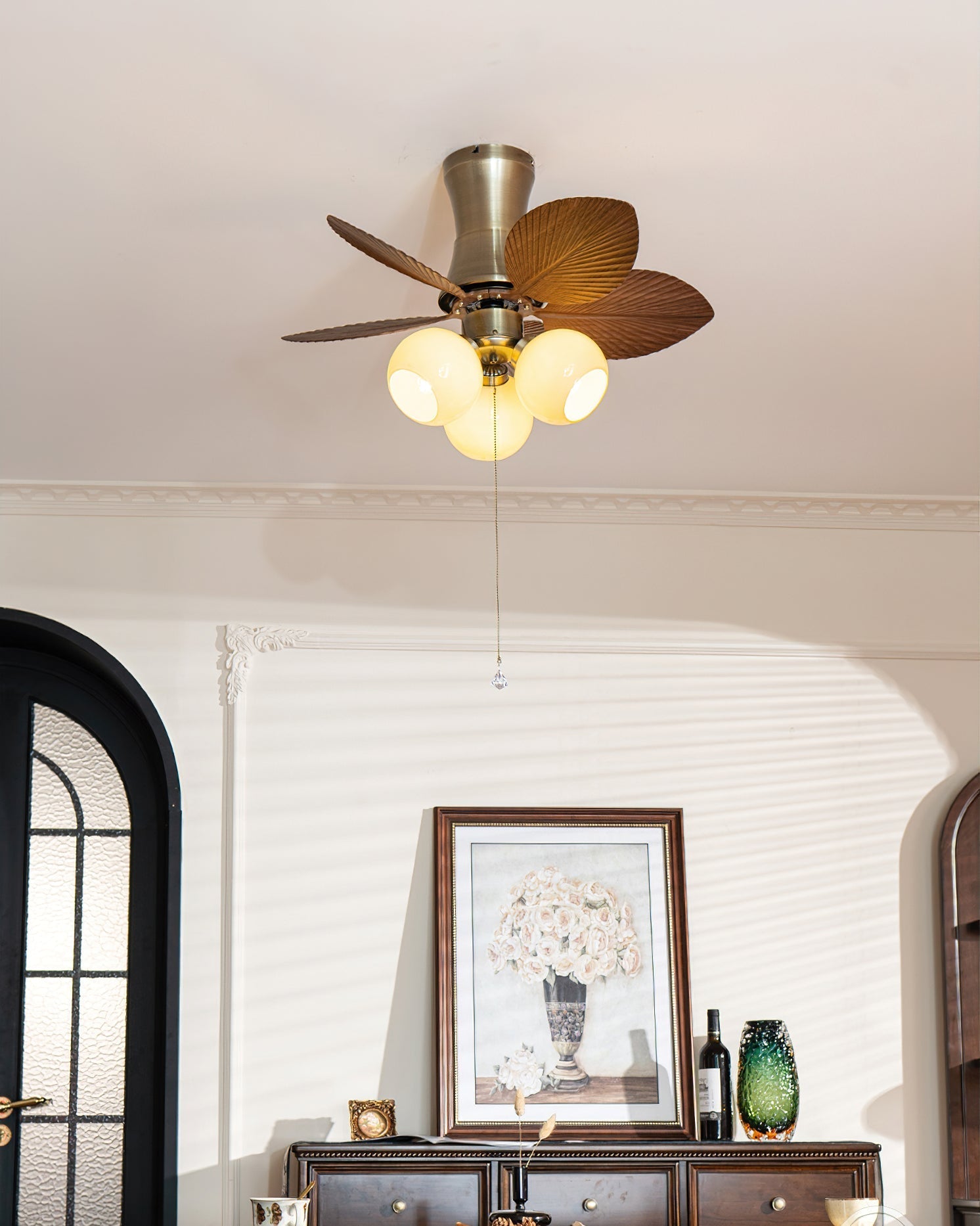 Glauk Ceiling Fan Light with Beige finish in a sunporch.