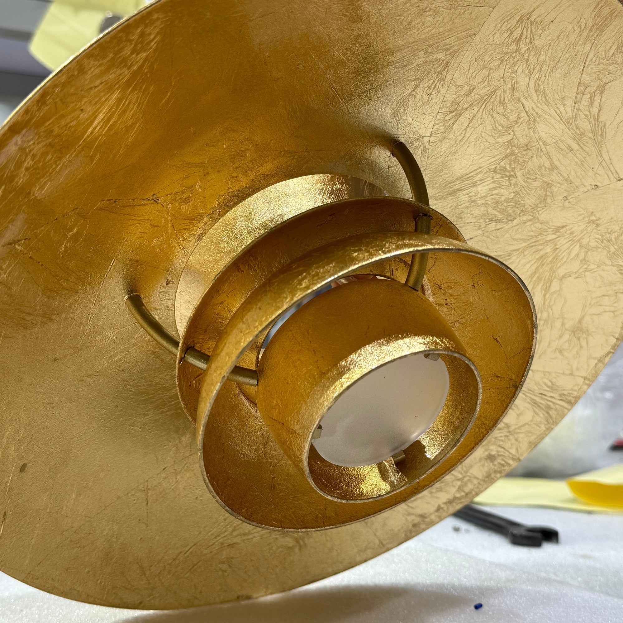 Close-up of the light reflecting off the gold foil layers.