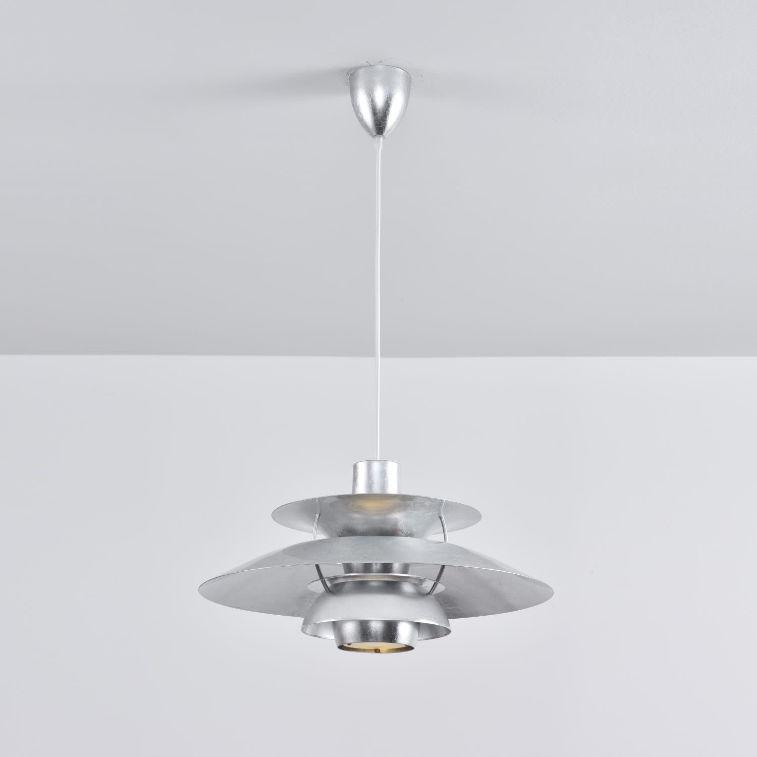 Silver Foil PH Pendant Lamp in a light, airy interior.