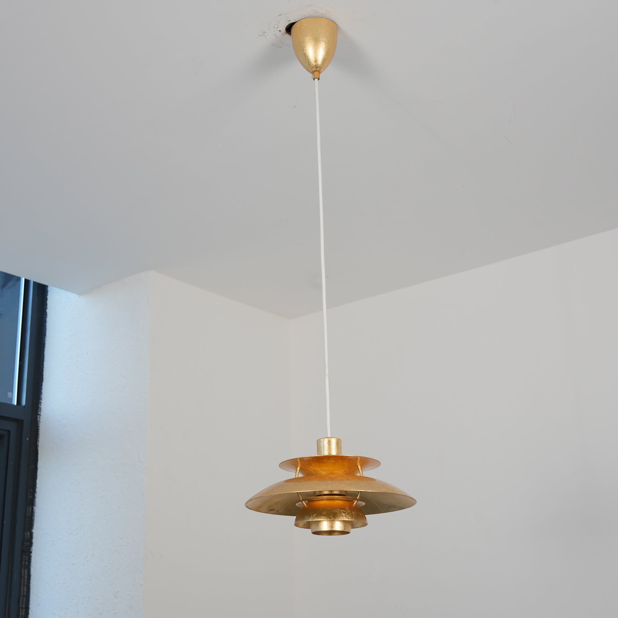 The 50cm Gold Foil PH Pendant Lamp in a room setting.
