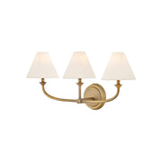 Greta Brass Wall Lamp with two heads against a neutral wall.