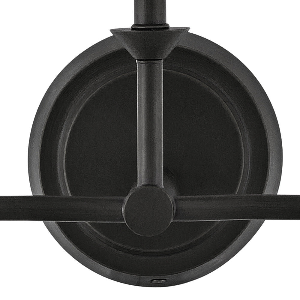 The Greta Wall Lamp as an accent light in a minimalist entryway.