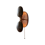Front view of the Greta Wall Lamp with a walnut wood body and black metal shade.