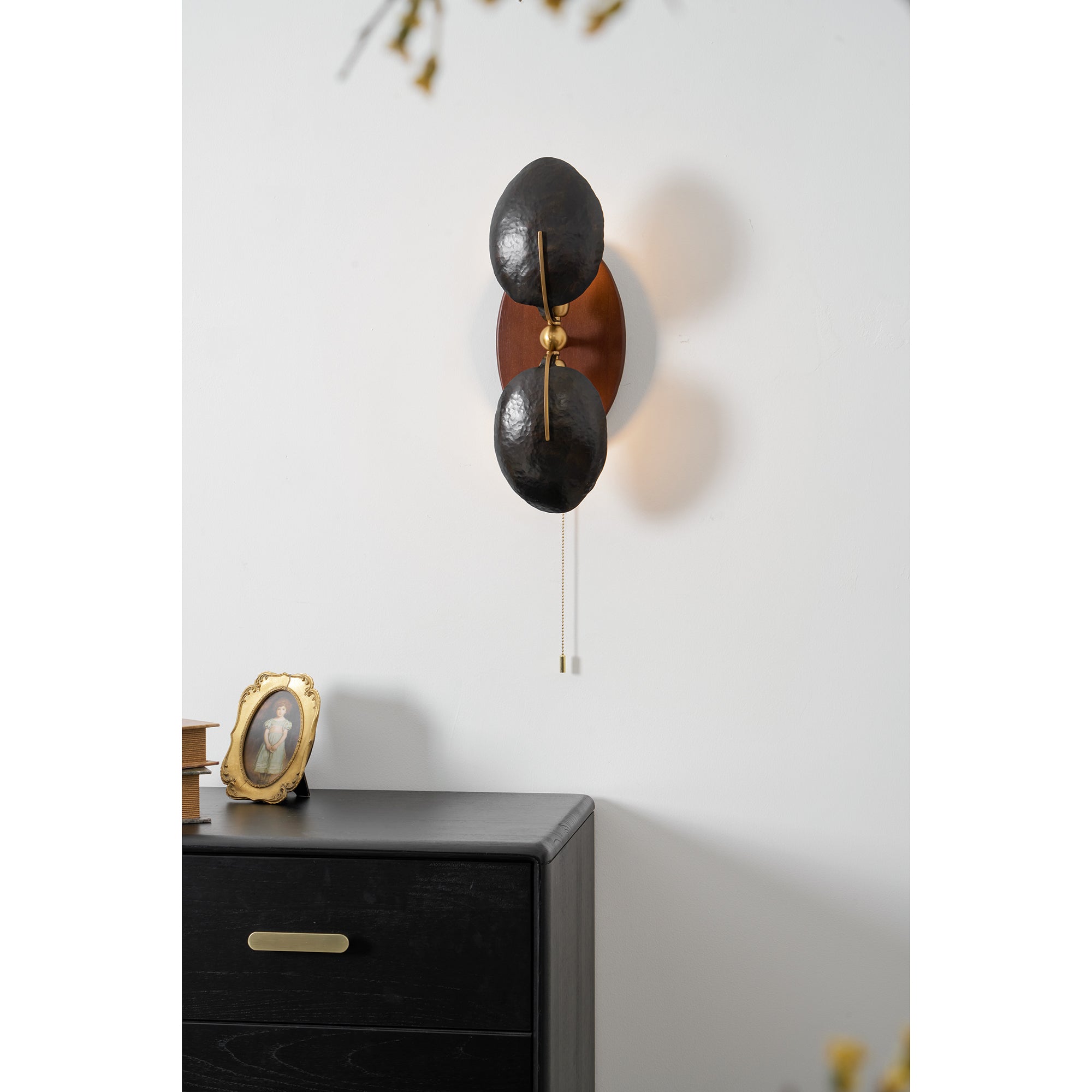 The warm glow emitted from the Greta Wall Lamp.