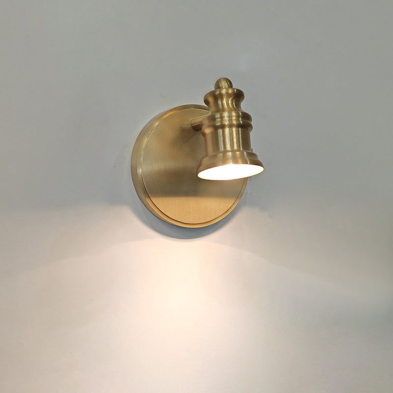 The three-head Halophane Brass Wall Lamp mounted on a light-colored wall.