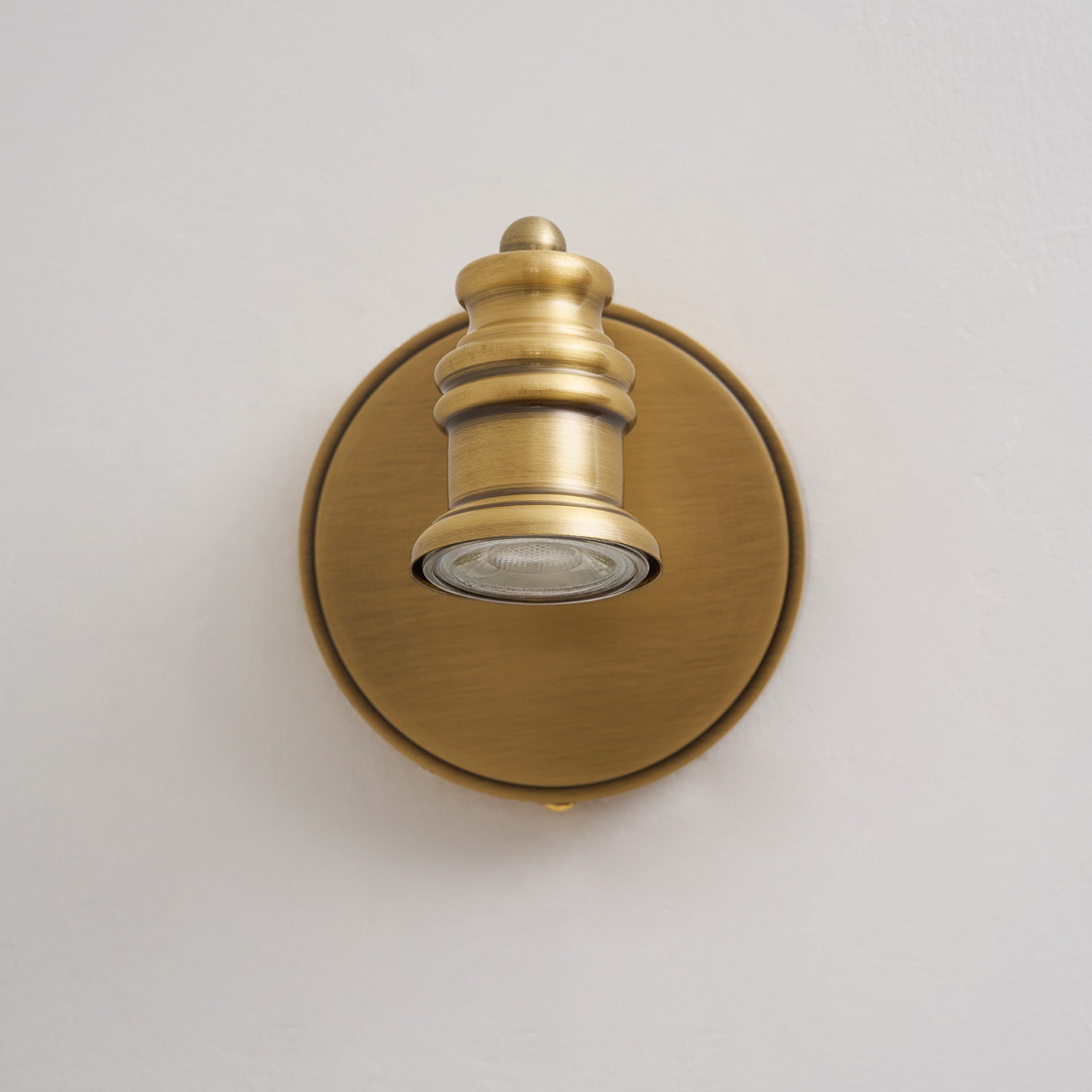 Four-head Halophane Brass Wall Lamp used for task lighting.