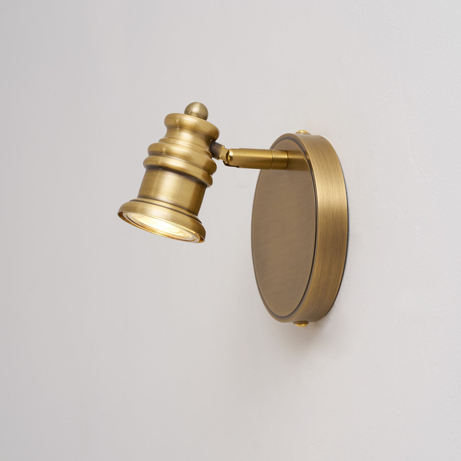 Halophane Brass Wall Lamp with five heads over a double vanity.