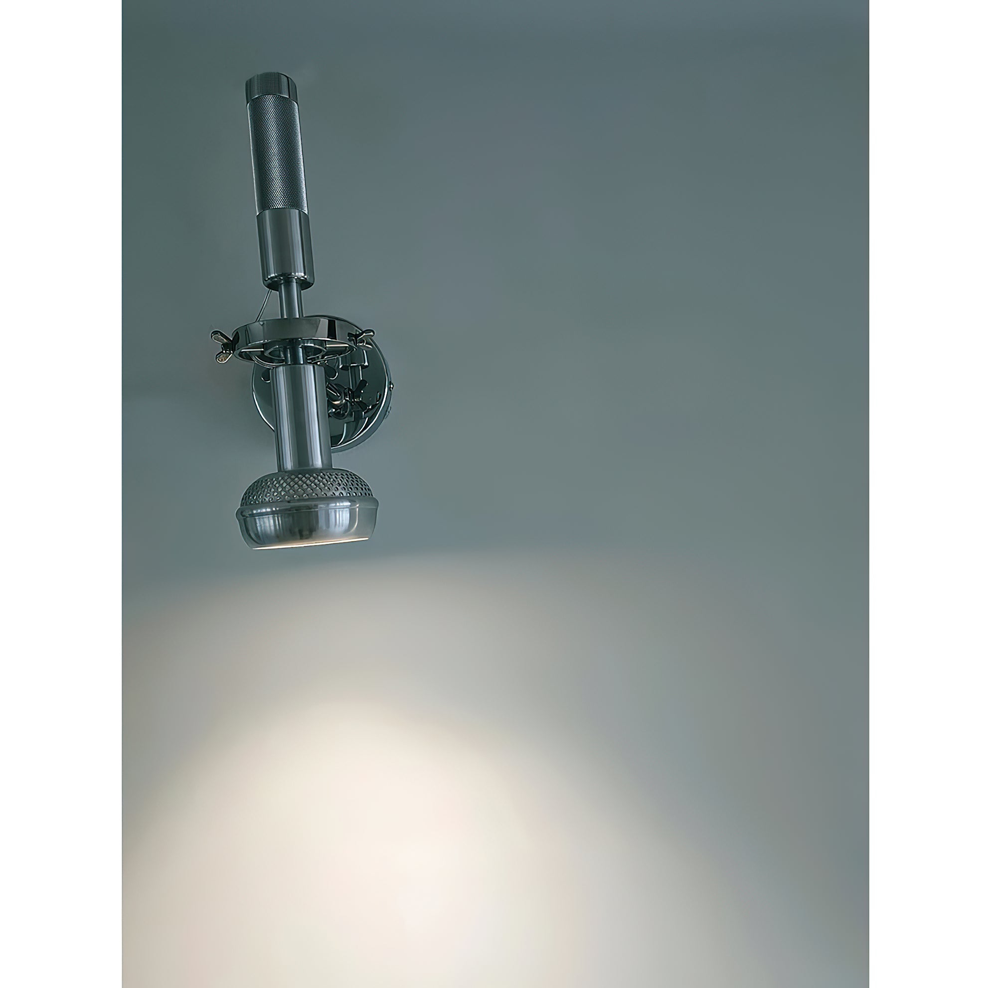 Lifestyle image of the Halva Wall Lamp providing ambient light in a living room.
