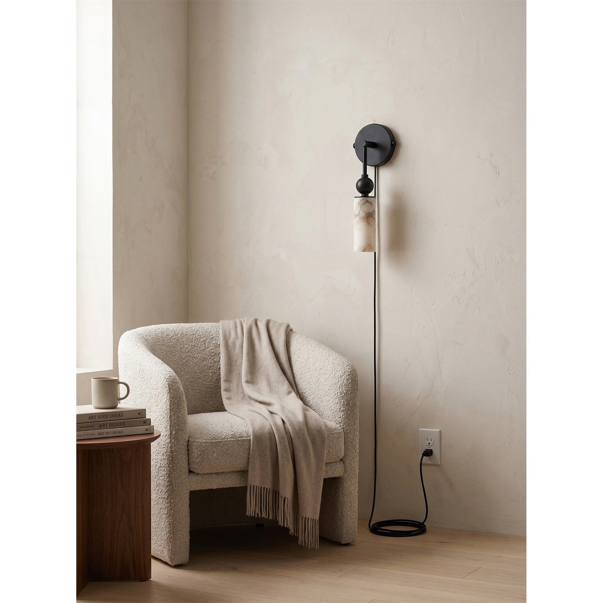 Angled view of the two-light brass sconce highlighting the staggered shades.