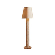 Hawksworth Floor Lamp with its striped shade in a modern living room.