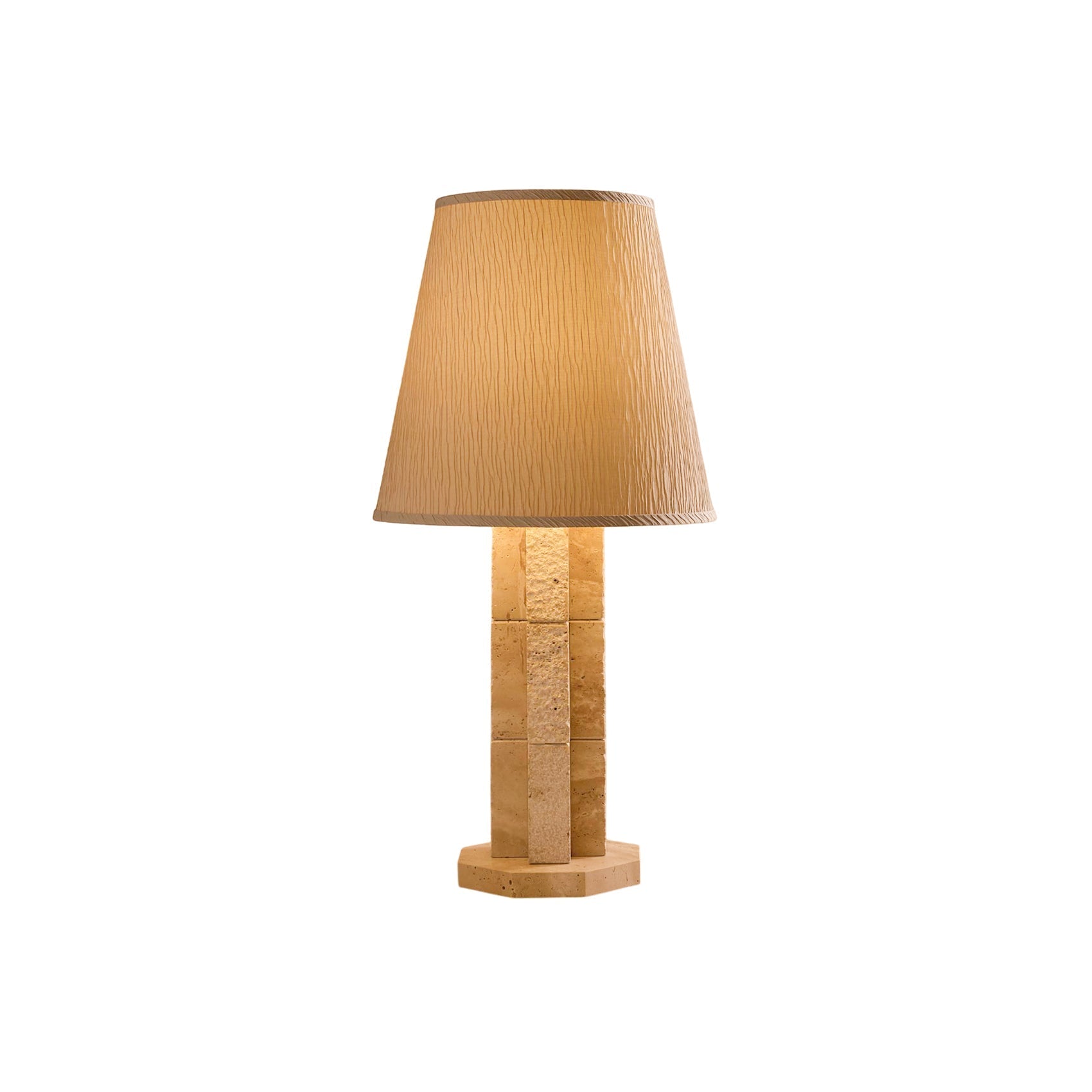 Hawksworth Table Lamp with its travertine octagonal stem and paper shade.