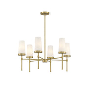 Haynes Chandelier in a brass finish with six tapered white glass shades.