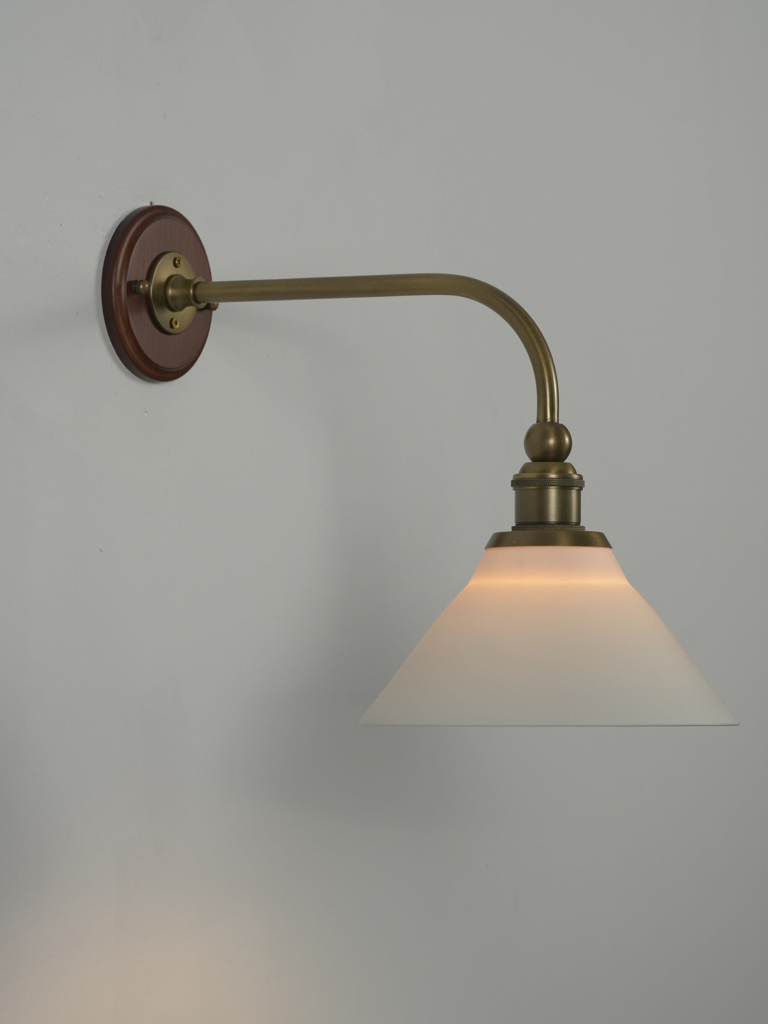 Heirloom wall lamp in a hallway.
