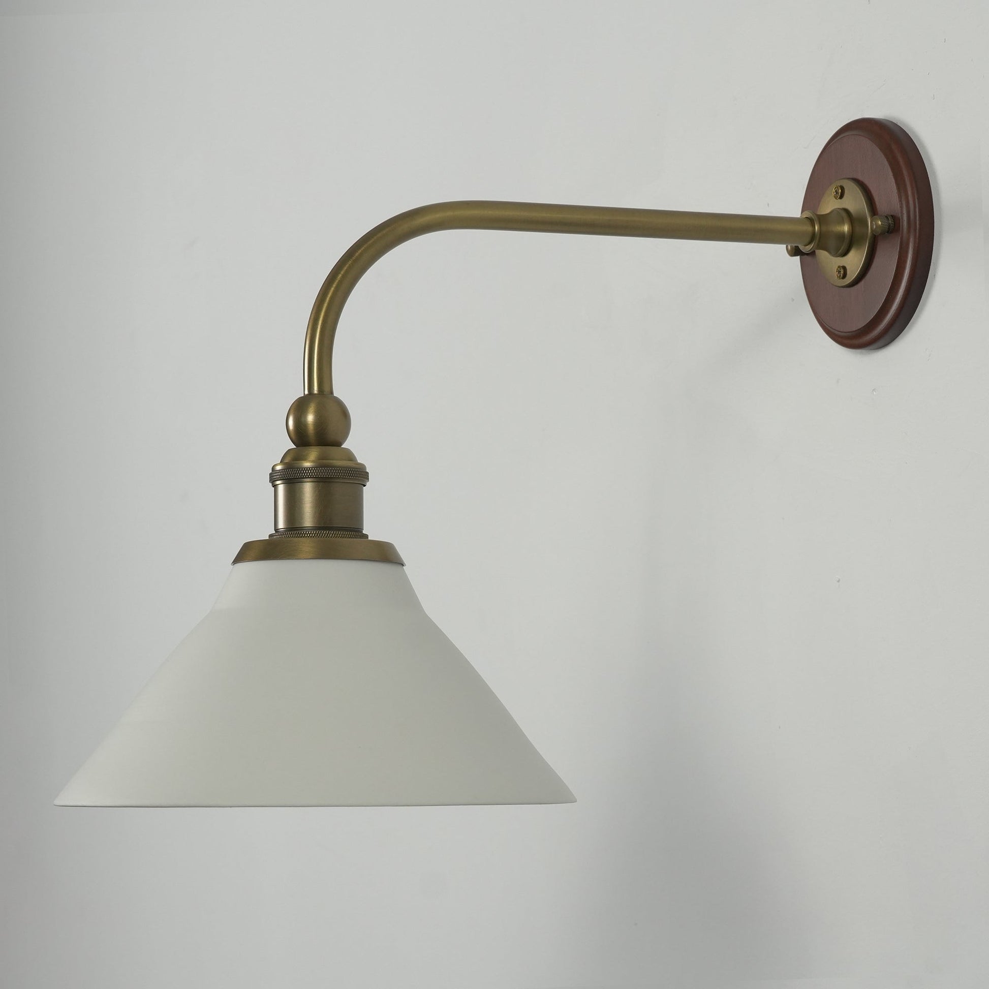 The elegant curve of the brass arm.
