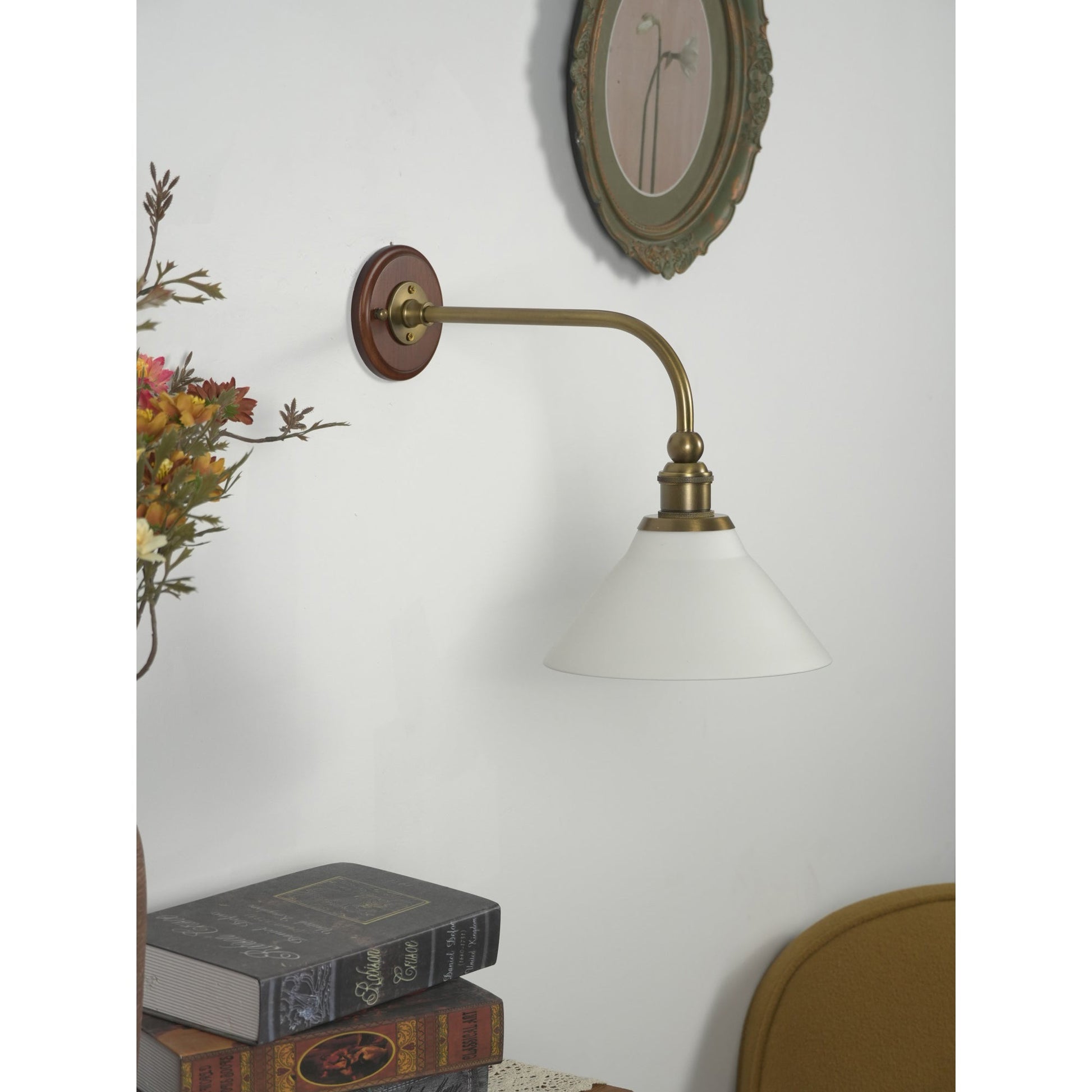 Heirloom wall lamp shown mounted in a living room.