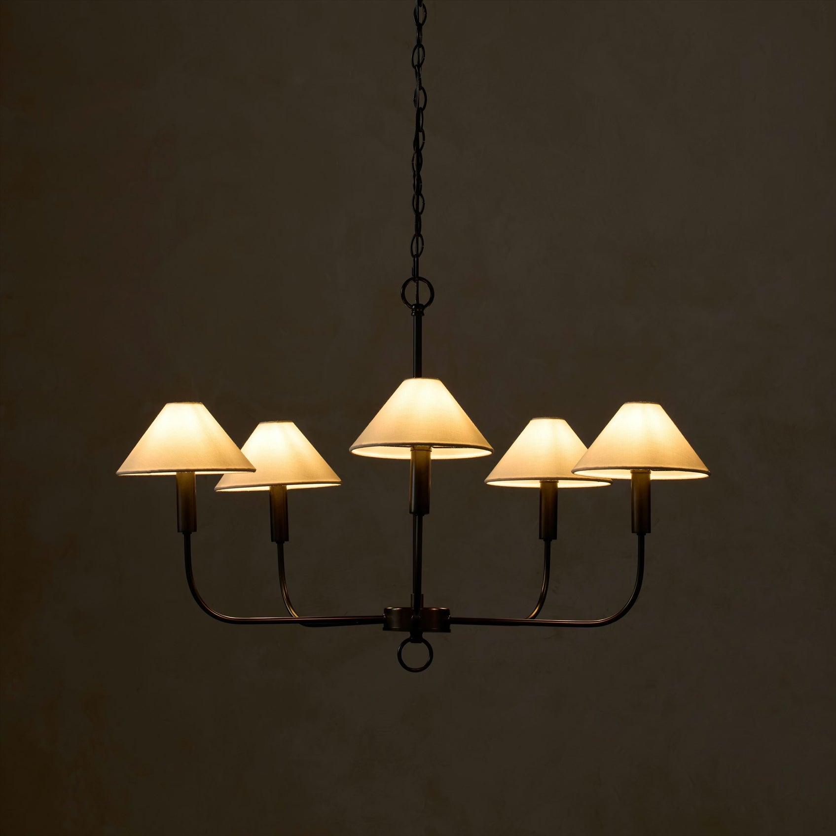 Lifestyle image of the Henry Chandelier in a dining area.