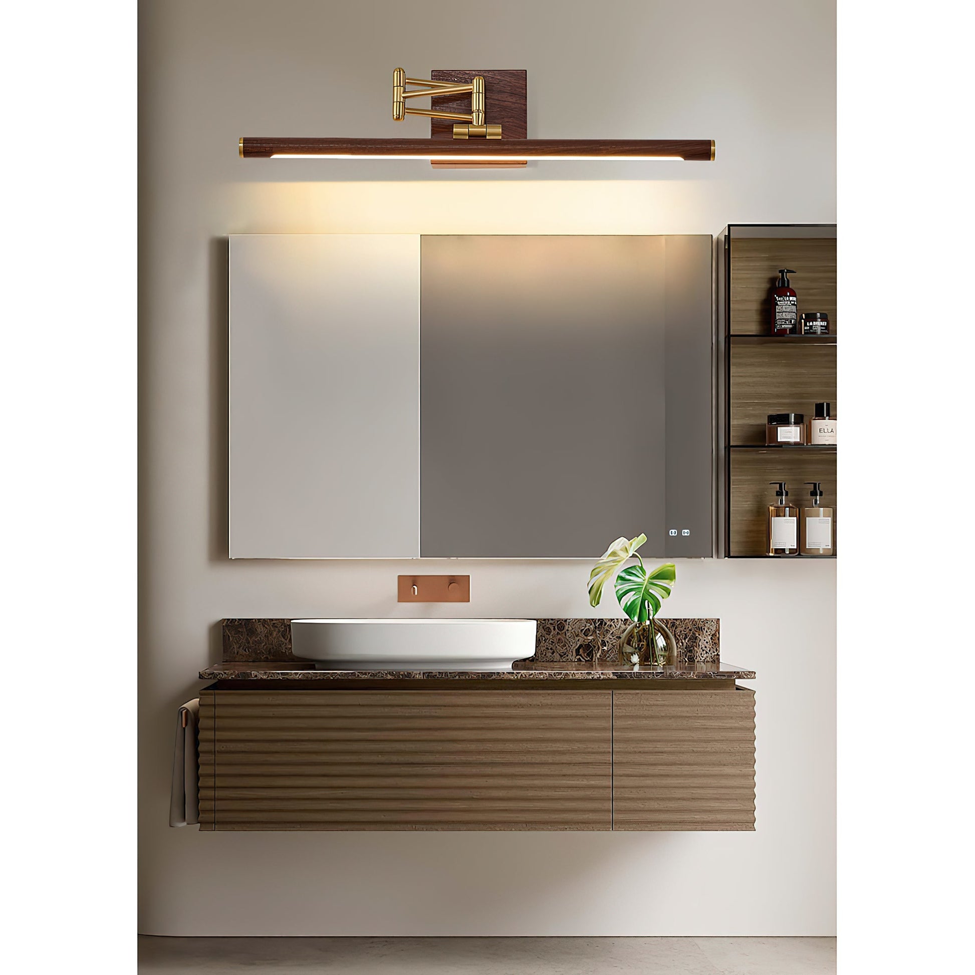 The Stokes wall lamp installed above a bathroom mirror.