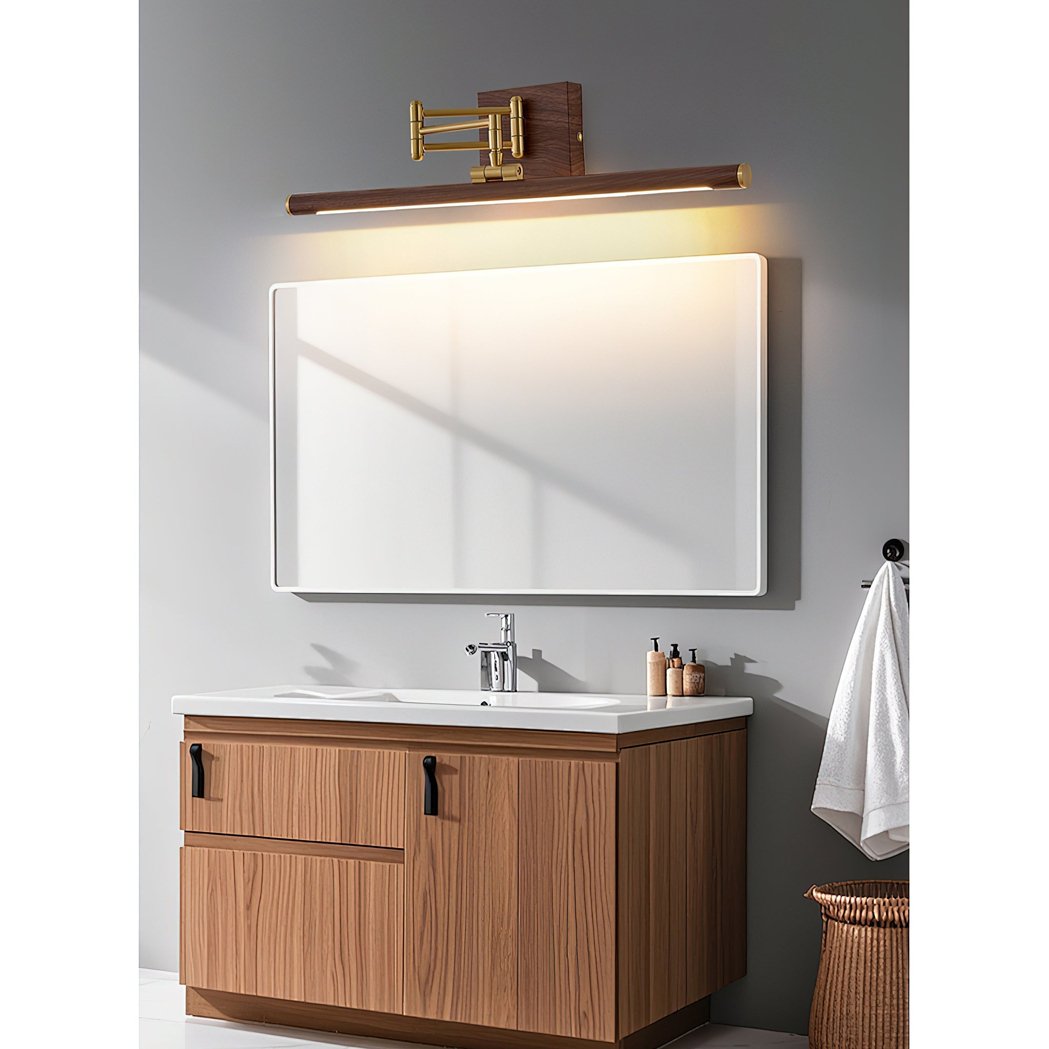 Lifestyle image of the brass wall lamp in a modern bathroom.