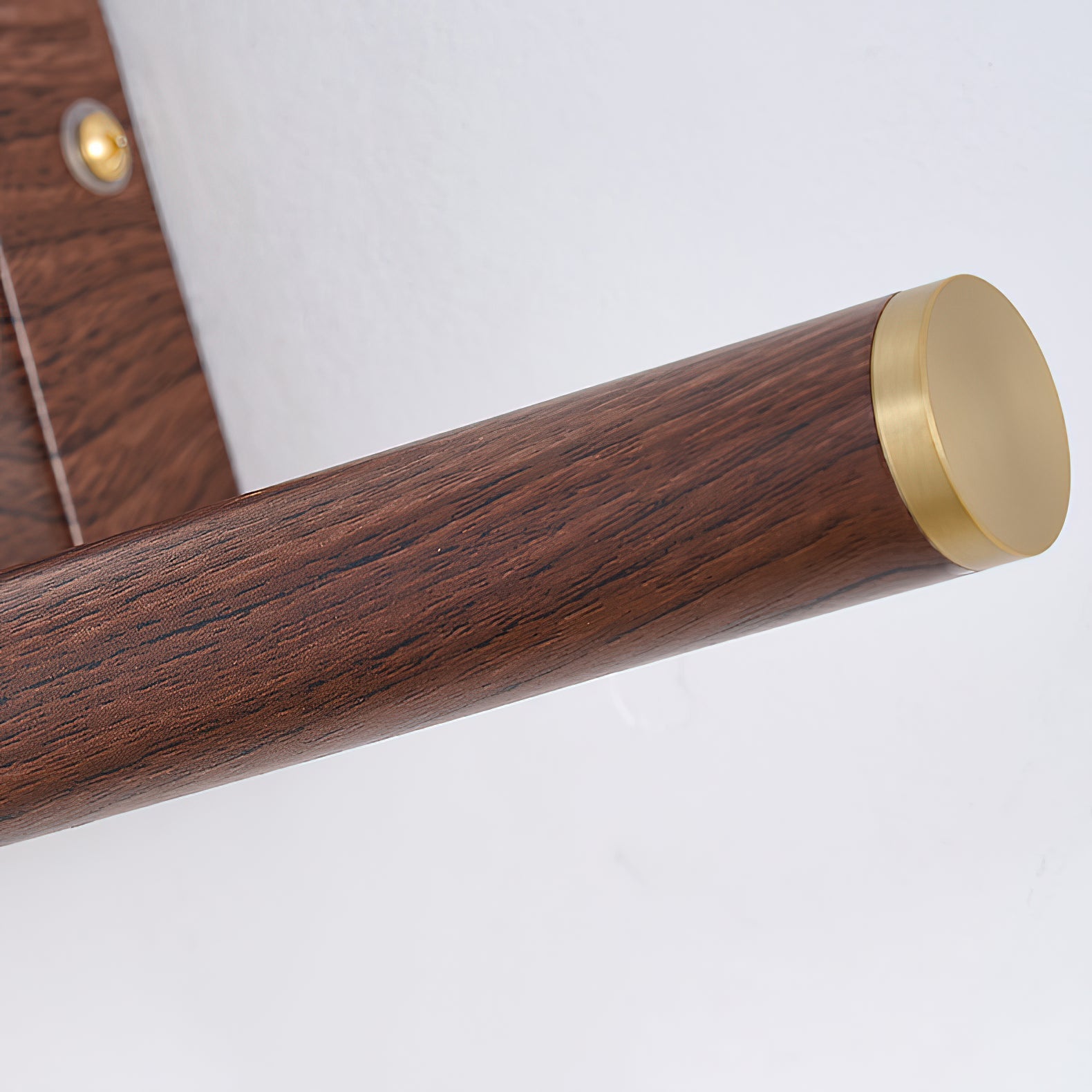 The Stokes wall lamp in a minimalist bathroom setting.