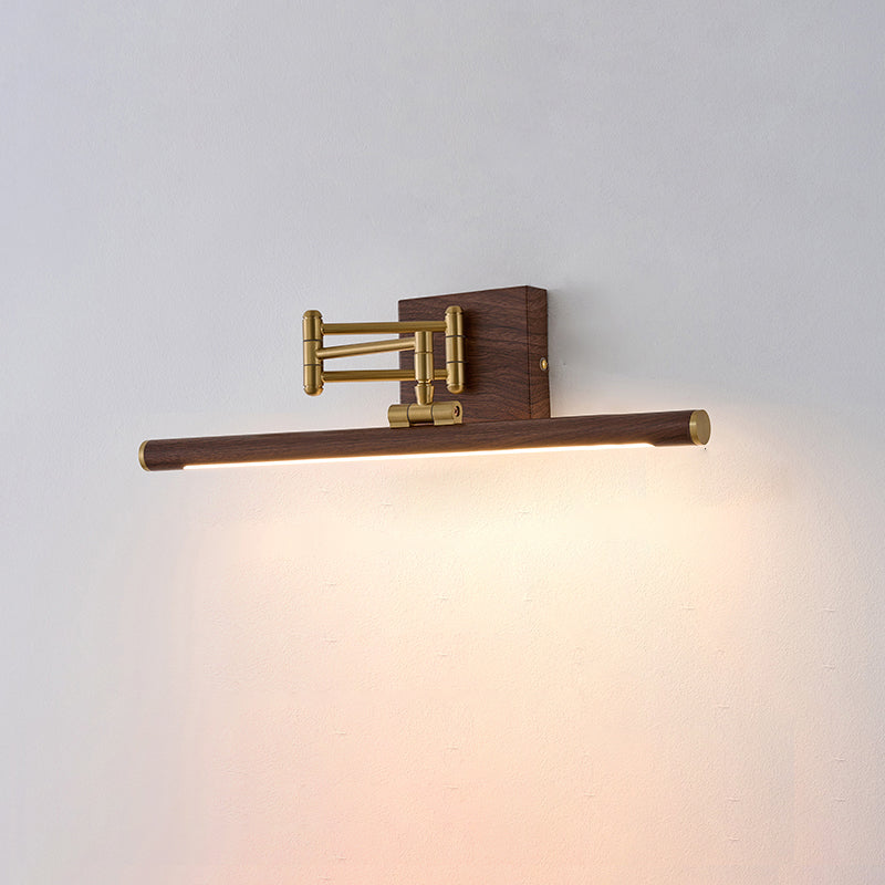 The brass wall lamp shown with light directed to the right.