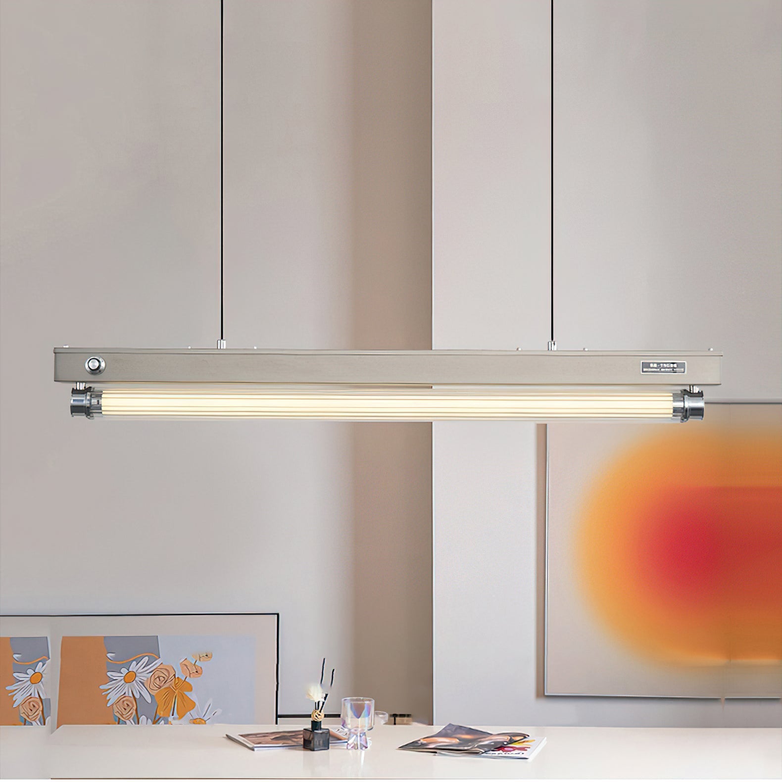 The black finish Hiromi Chandelier suspended in a minimalist living room.