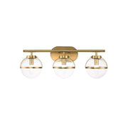 Hollis Wall Lamp with two heads in brass finish and clear glass shades.