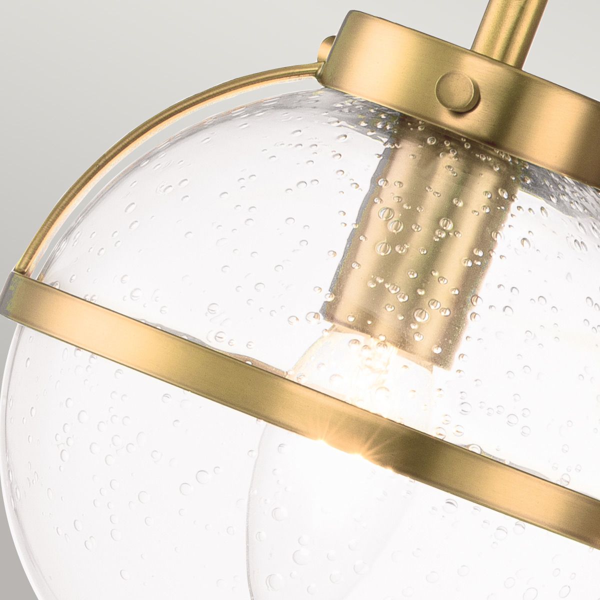 Detail shot of the clear glass lampshade on the Hollis Wall Lamp.