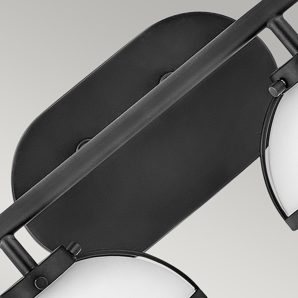 Angled view of the two-head Hollis Wall Lamp in brass.
