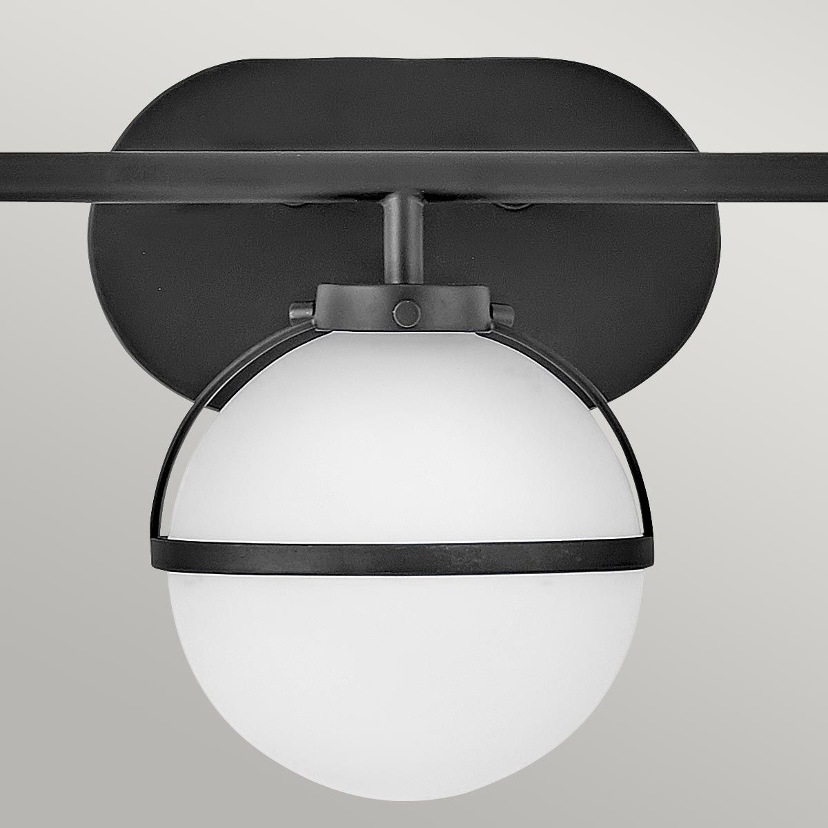 Hollis Wall Lamp installed in a modern living room setting.