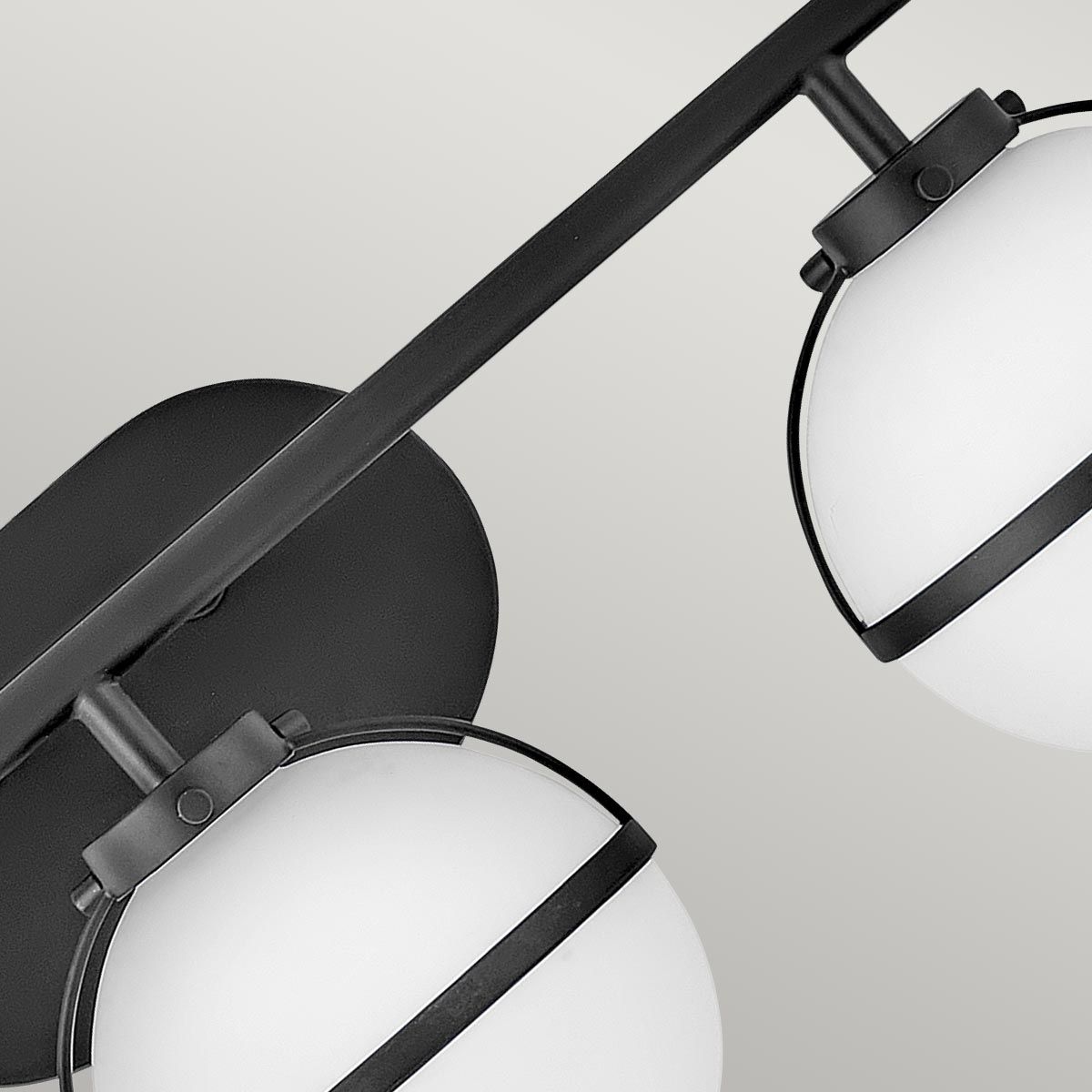 Full view of the three-head Hollis Wall Lamp in brass and white glass.