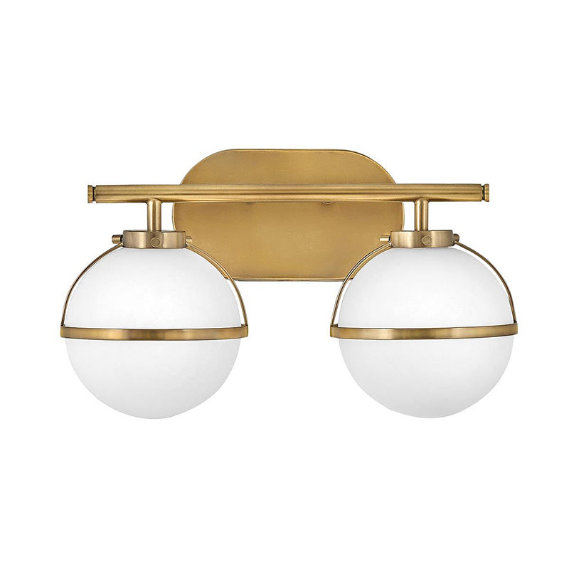 Hollis Wall Lamp with three heads in brass finish and clear glass shades.