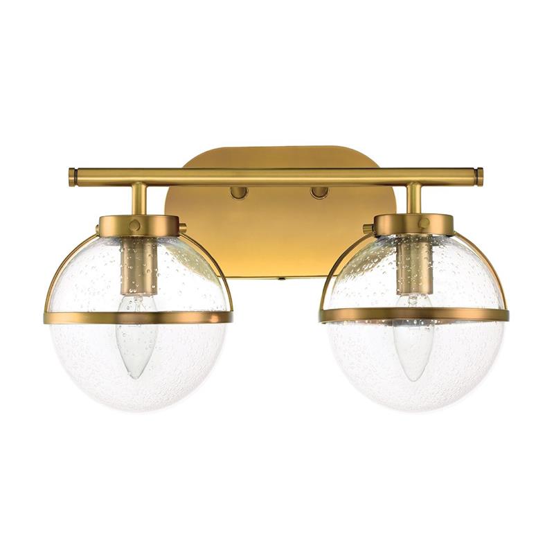 Lifestyle image of the Hollis Wall Lamp in a bedroom.