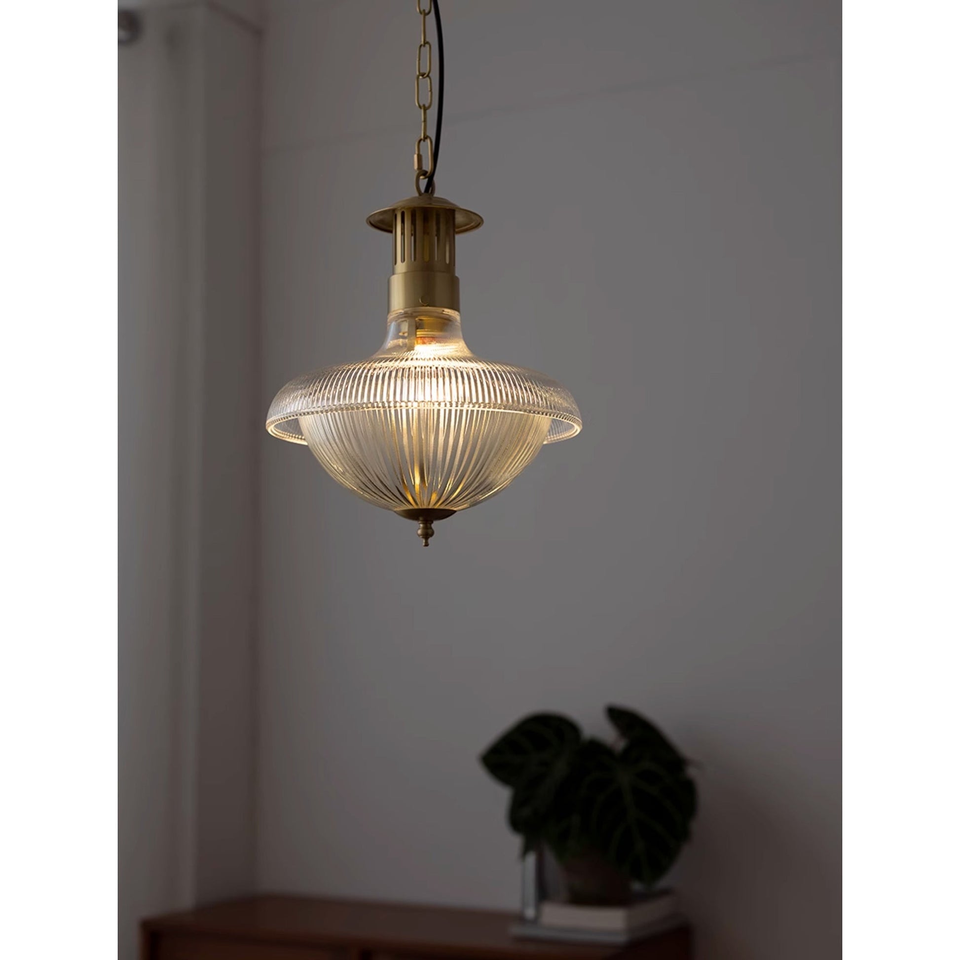 Holophane pendant lamp in a living room with high ceilings.