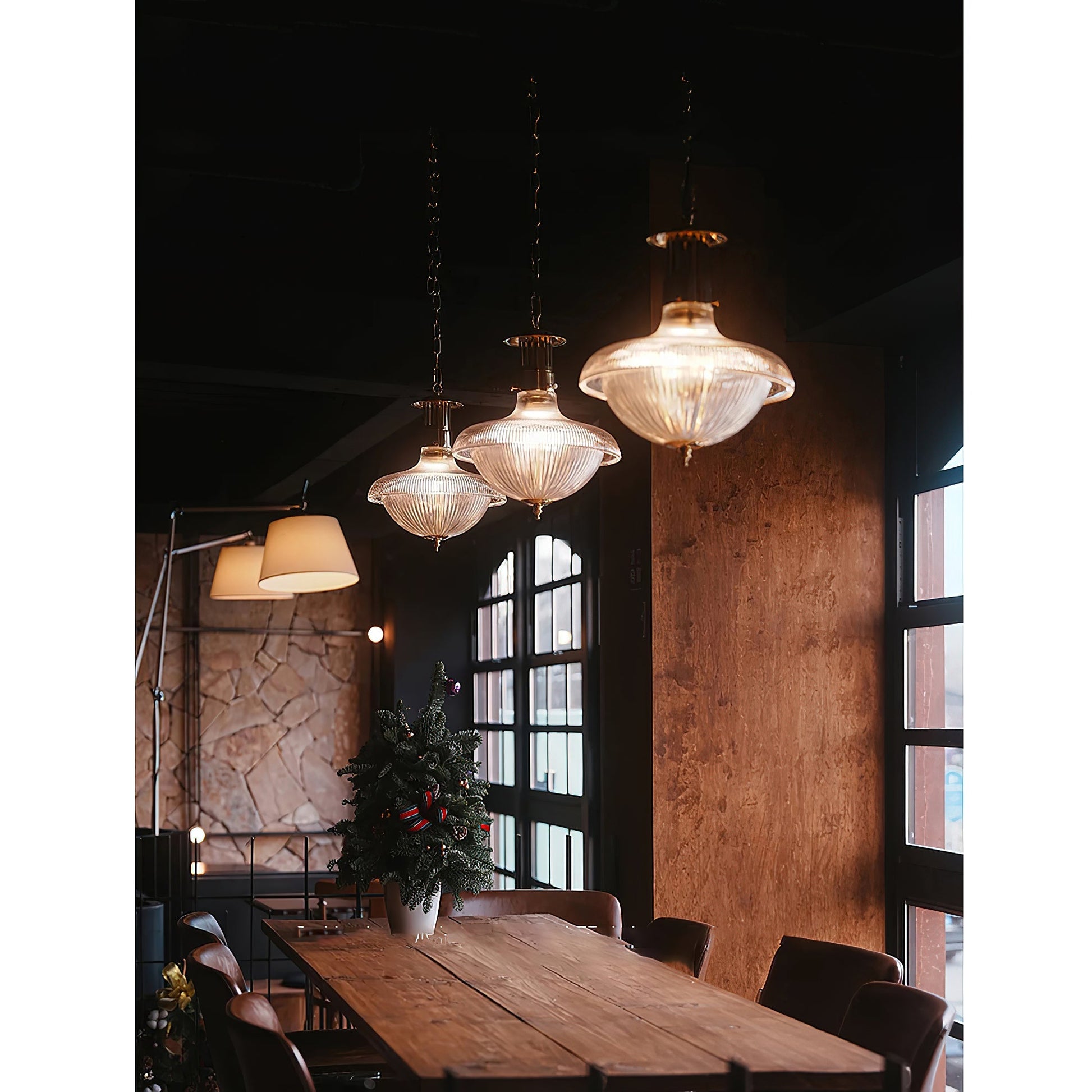 The lamp hanging over a small round table.