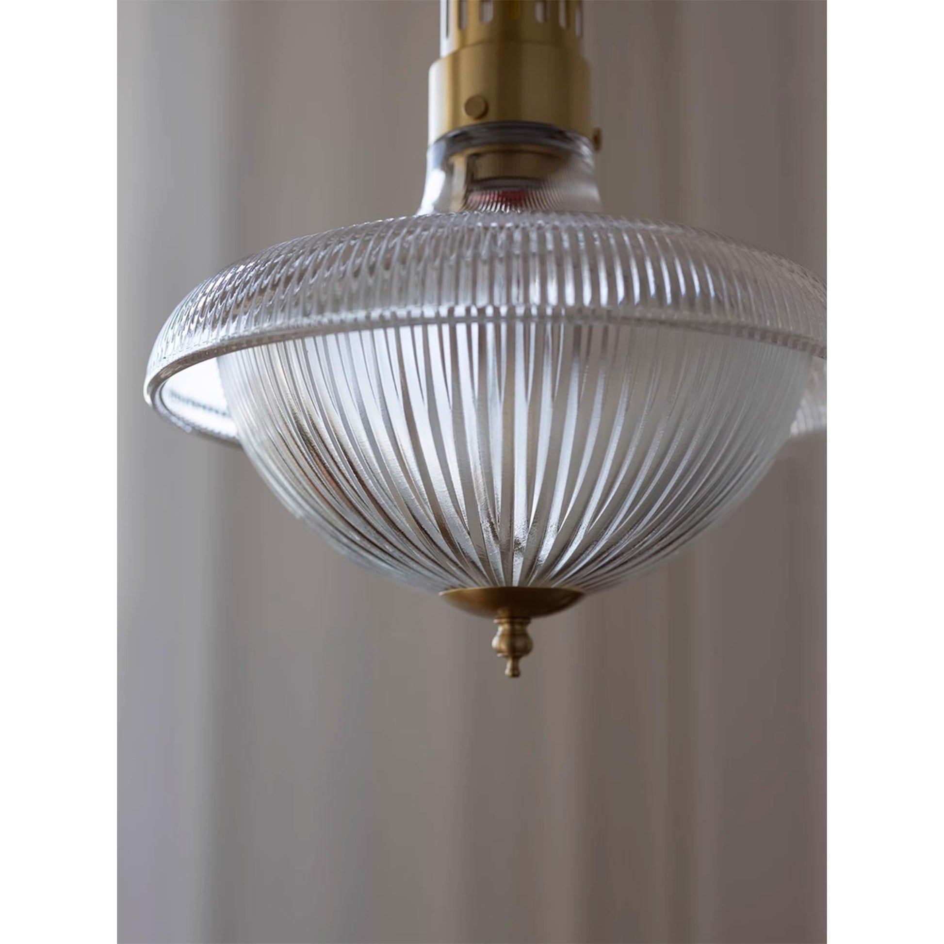The lamp shown in a commercial setting like a cafe or bar.
