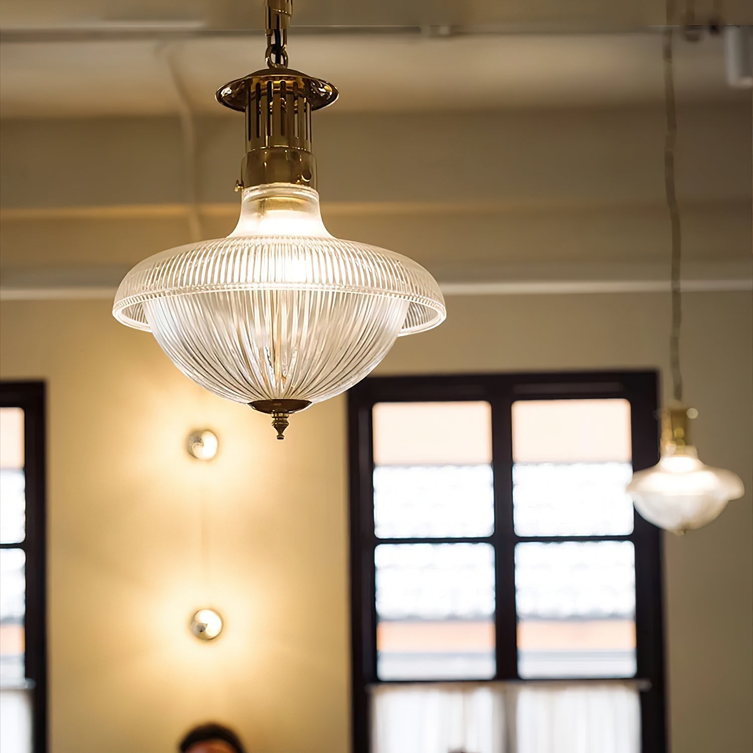 Close-up of the ribbed glass shade on the Holophane pendant lamp.
