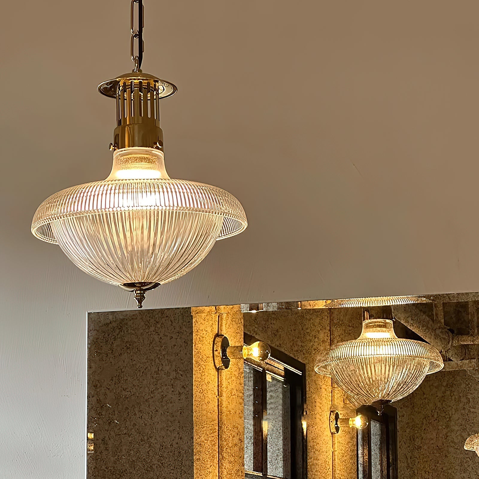 Detail shot of the gold metal lamp body and minimalist holder.