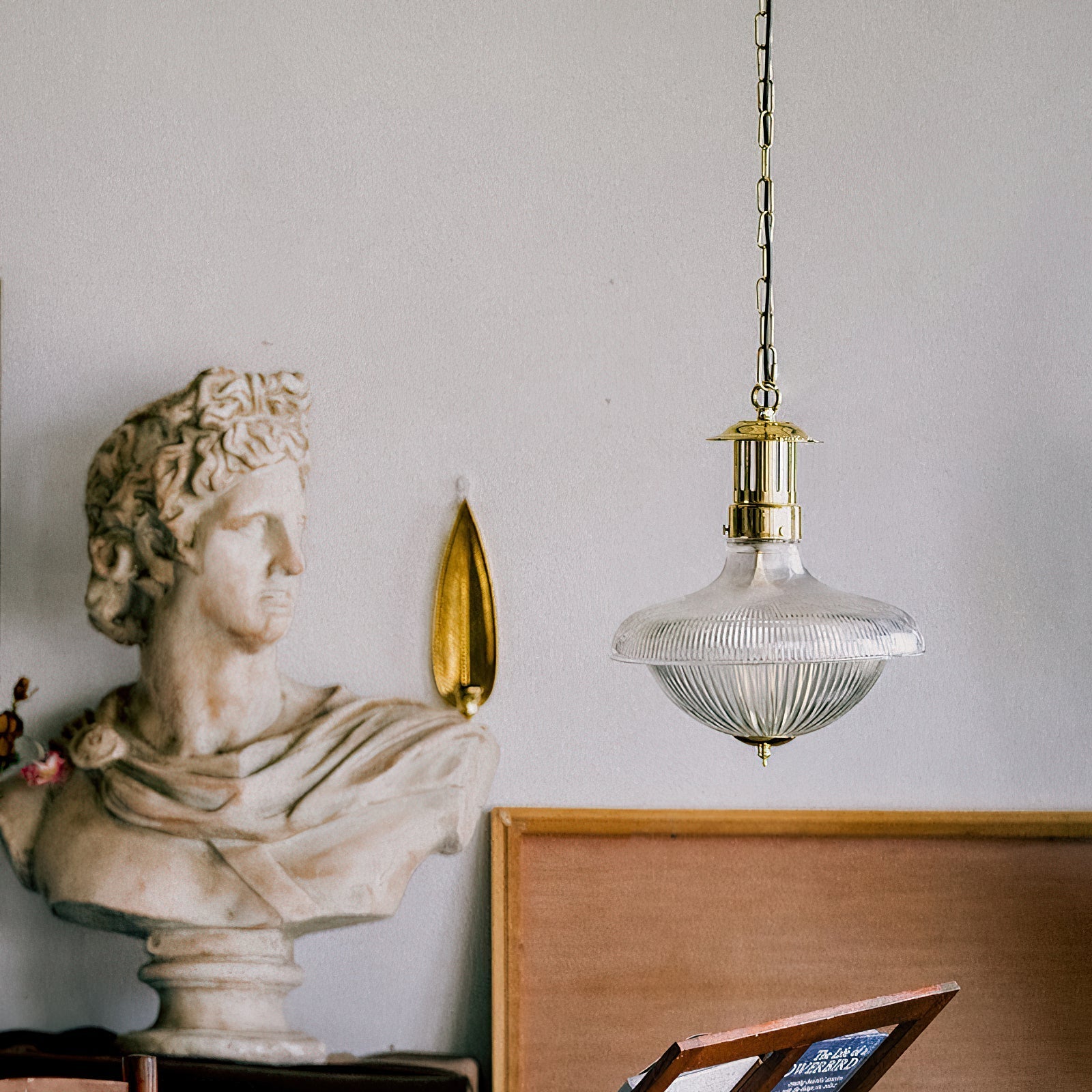 The pendant lamp shown from a side angle, highlighting its dimensions.