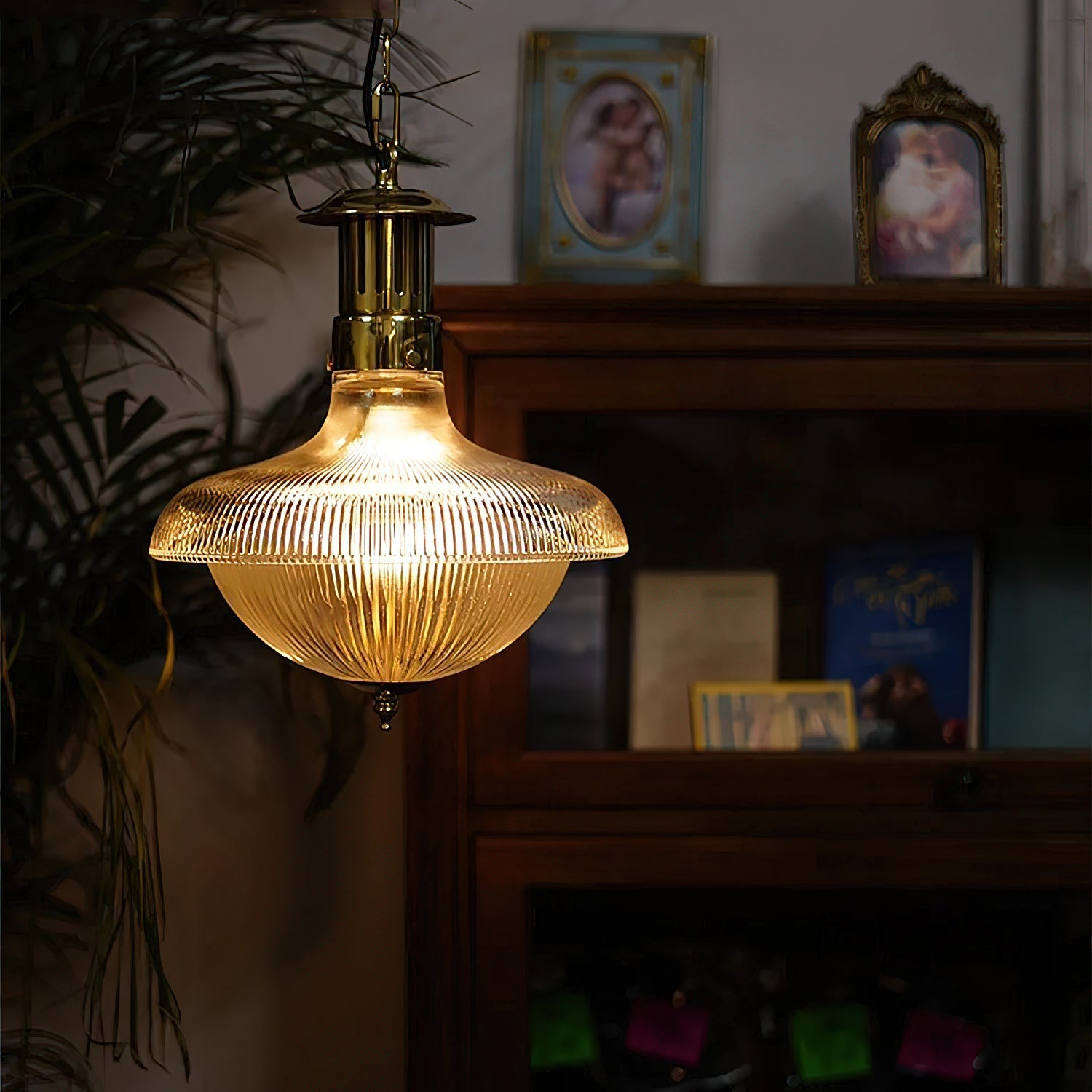 Holophane pendant lamp illuminated, casting a warm glow.