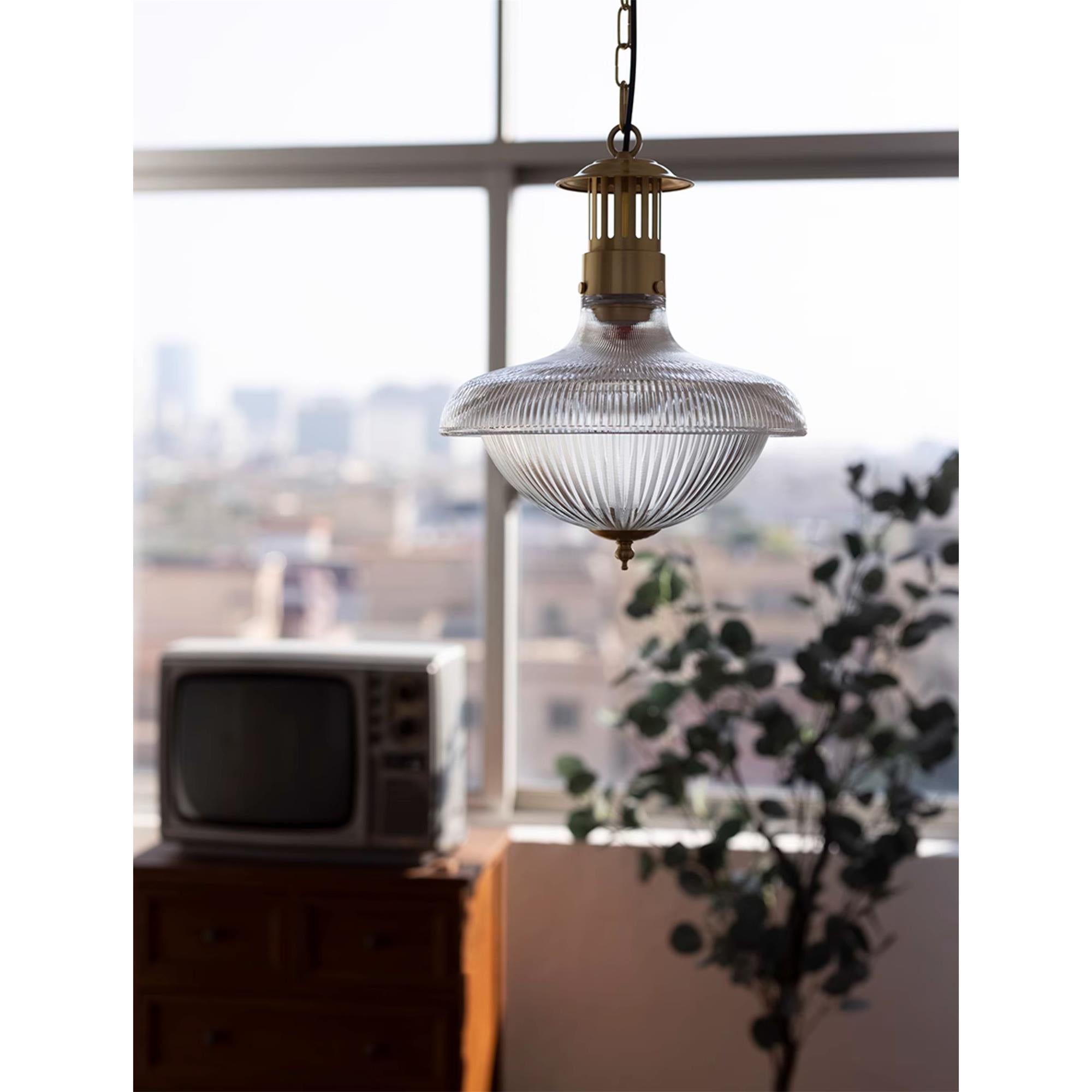 Lifestyle image of the pendant lamp in a dining room setting.