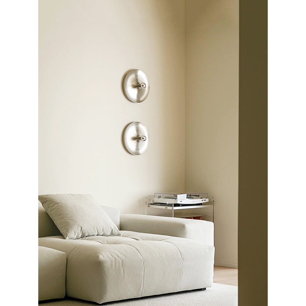 The wall lamp as a stylish accent in a contemporary bedroom.